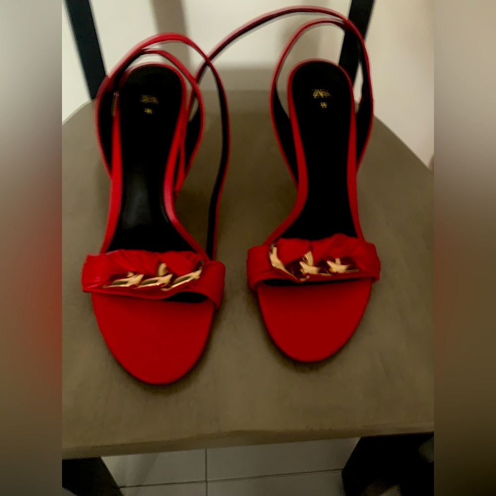New red strap open toe pumps